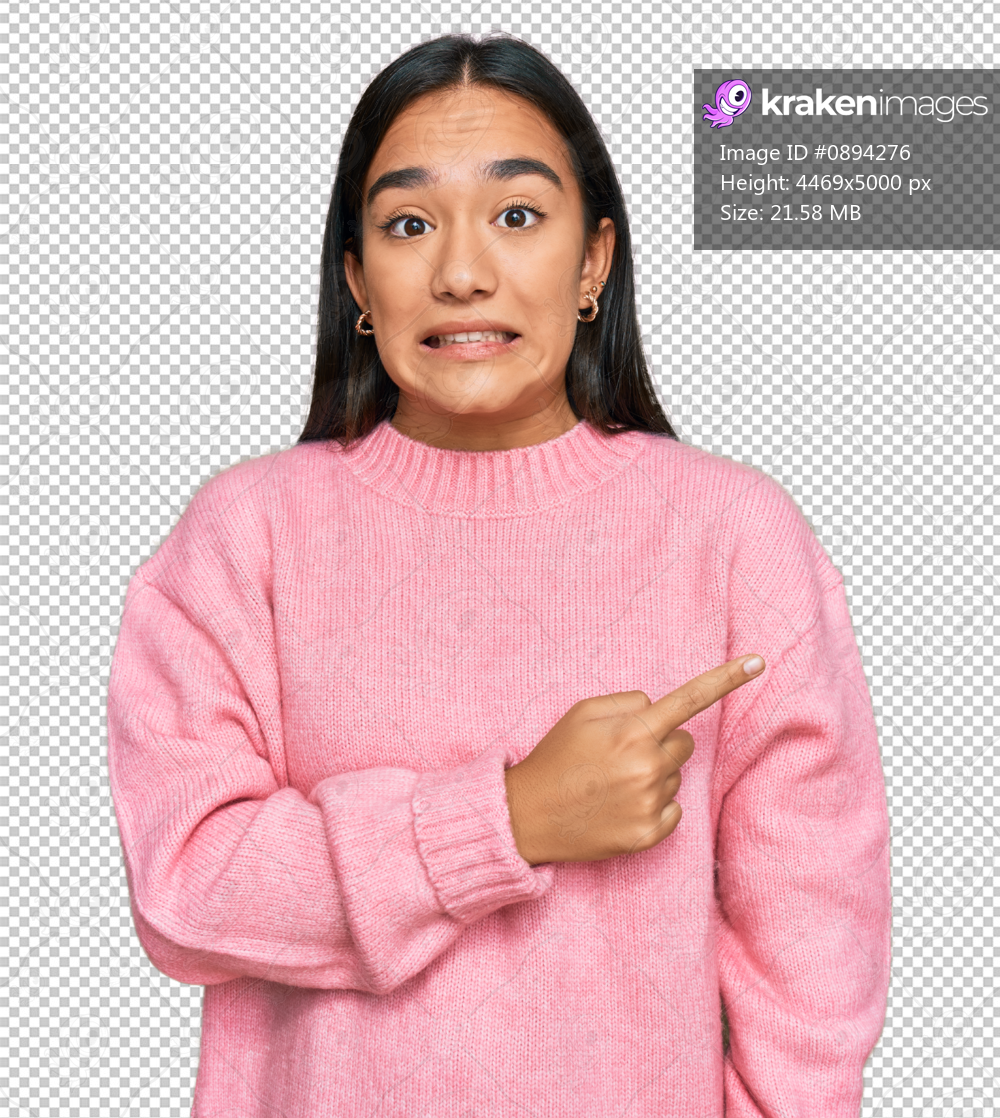 Young asian woman wearing casual winter sweater pointing aside worried and nervous with forefinger, concerned and surprised expression