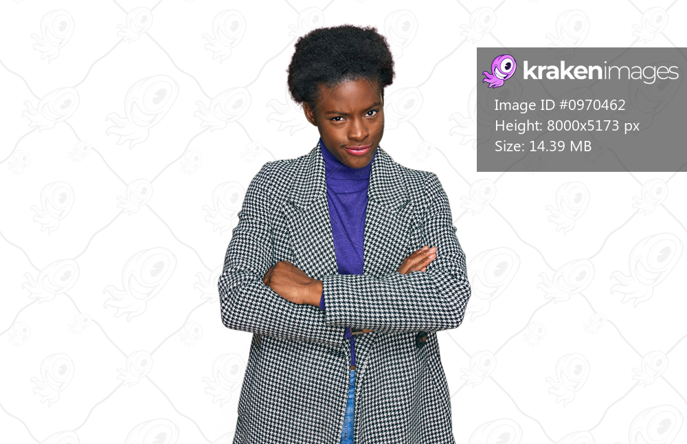 Young african american girl wearing casual clothes skeptic and nervous, disapproving expression on face with crossed arms. negative person. 