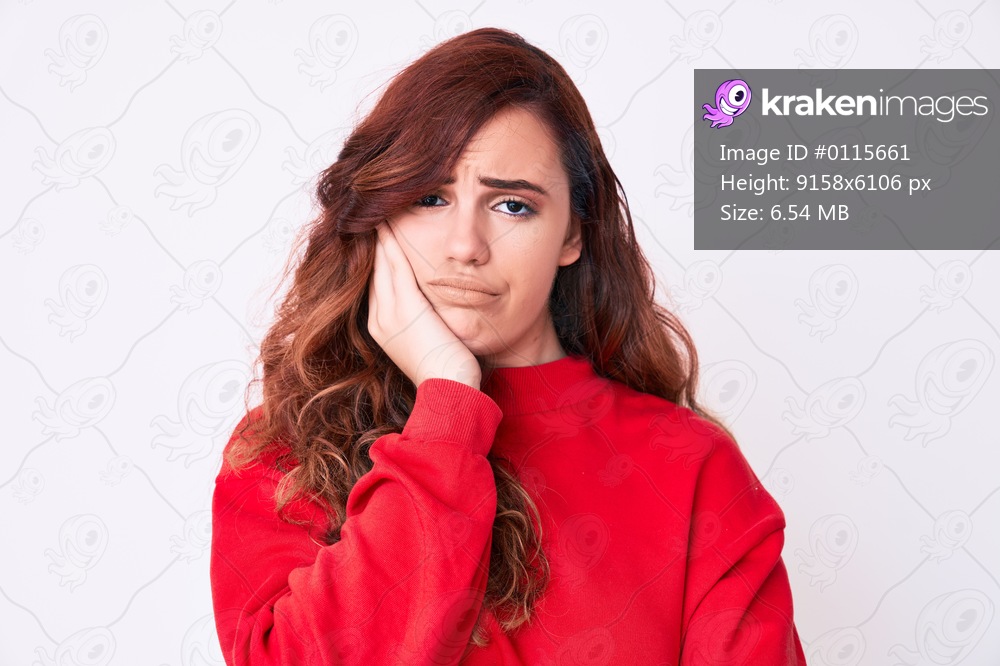 Young beautiful woman wearing casual clothes thinking looking tired and bored with depression problems with crossed arms. 