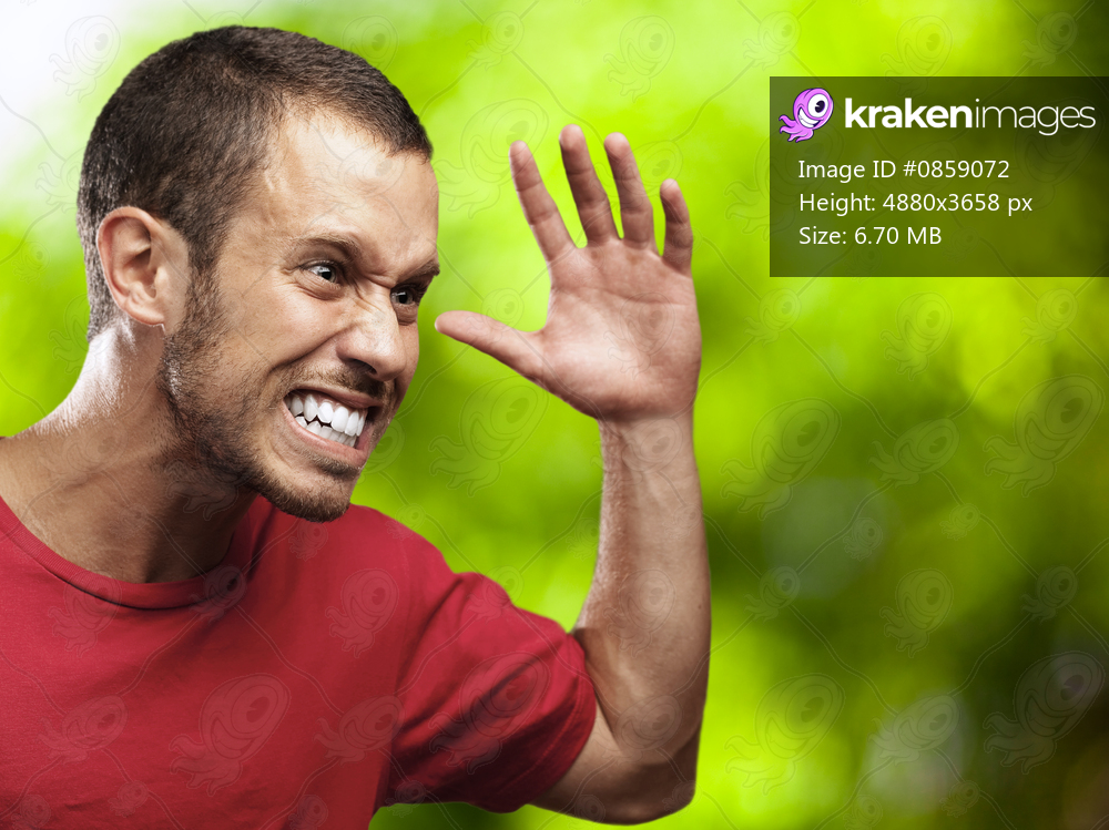 angry young man with plants as a background