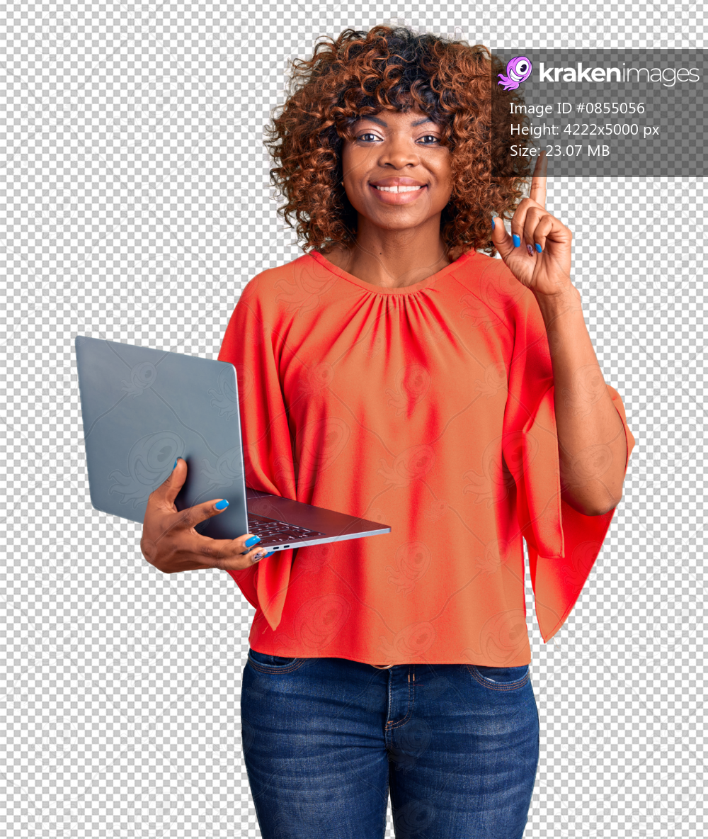 Young african american woman working using computer laptop surprised with an idea or question pointing finger with happy face, number one