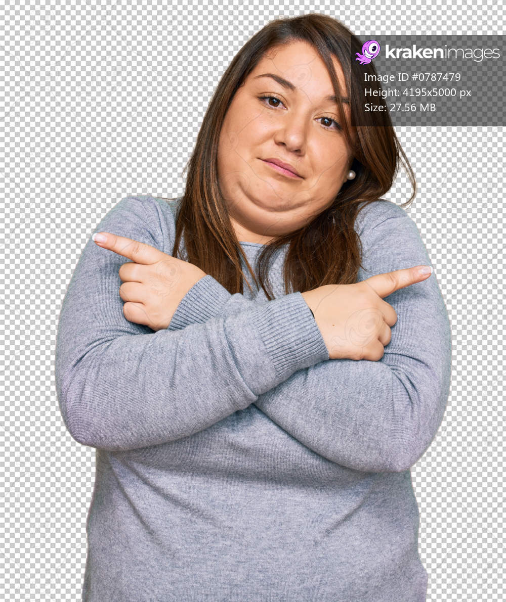 Beautiful brunette plus size woman wearing casual clothes pointing to both sides with fingers, different direction disagree