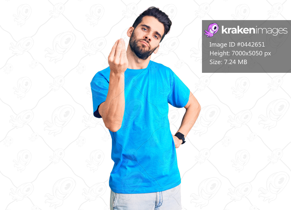 Young handsome man with beard wearing casual t-shirt doing italian gesture with hand and fingers confident expression 