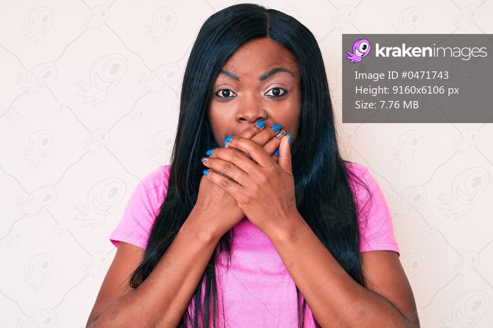 Young african american woman wearing casual clothes shocked covering mouth with hands for mistake. secret concept. 