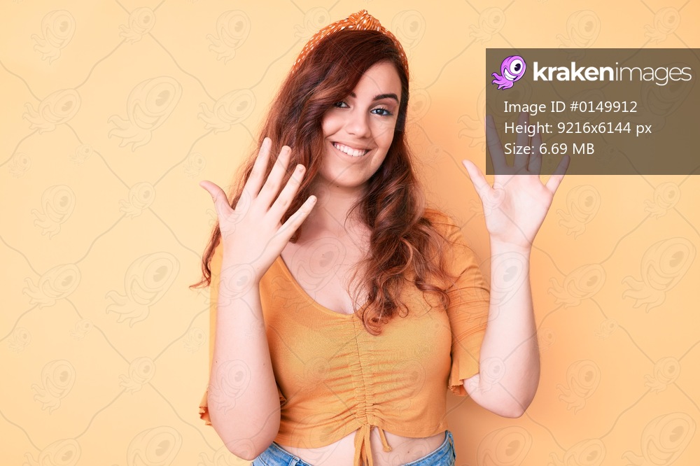 Young beautiful woman wearing casual clothes showing and pointing up with fingers number ten while smiling confident and happy. 