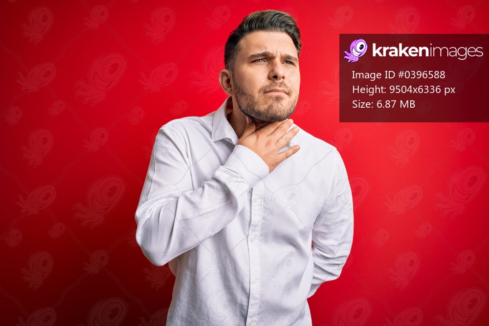 Young business man with blue eyes wearing elegant shirt standing over red isolated background Touching painful neck, sore throat for flu, clod and infection