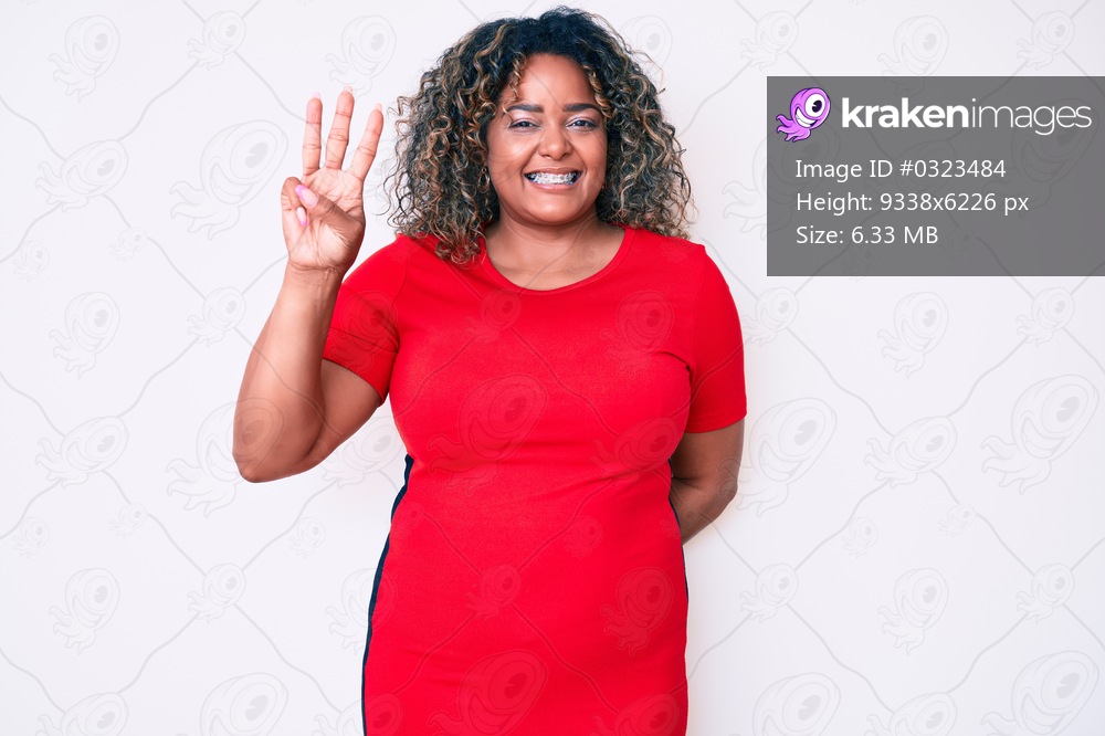 Young african american plus size woman wearing casual clothes showing and pointing up with fingers number three while smiling confident and happy. 
