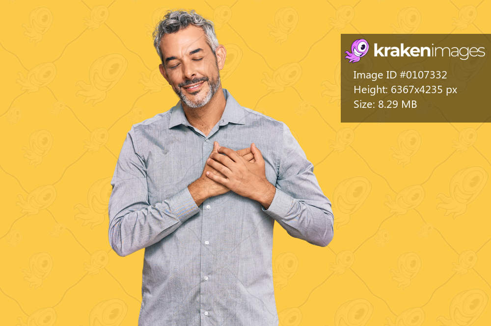 Middle age grey-haired man wearing casual clothes smiling with hands on chest with closed eyes and grateful gesture on face. health concept. 