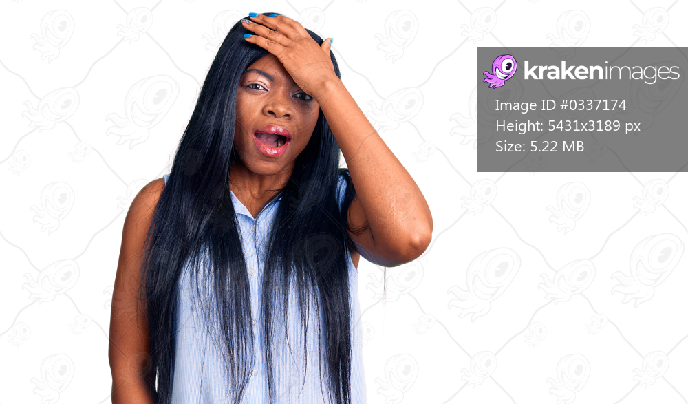 Young african american woman wearing casual clothes surprised with hand on head for mistake, remember error. forgot, bad memory concept. 