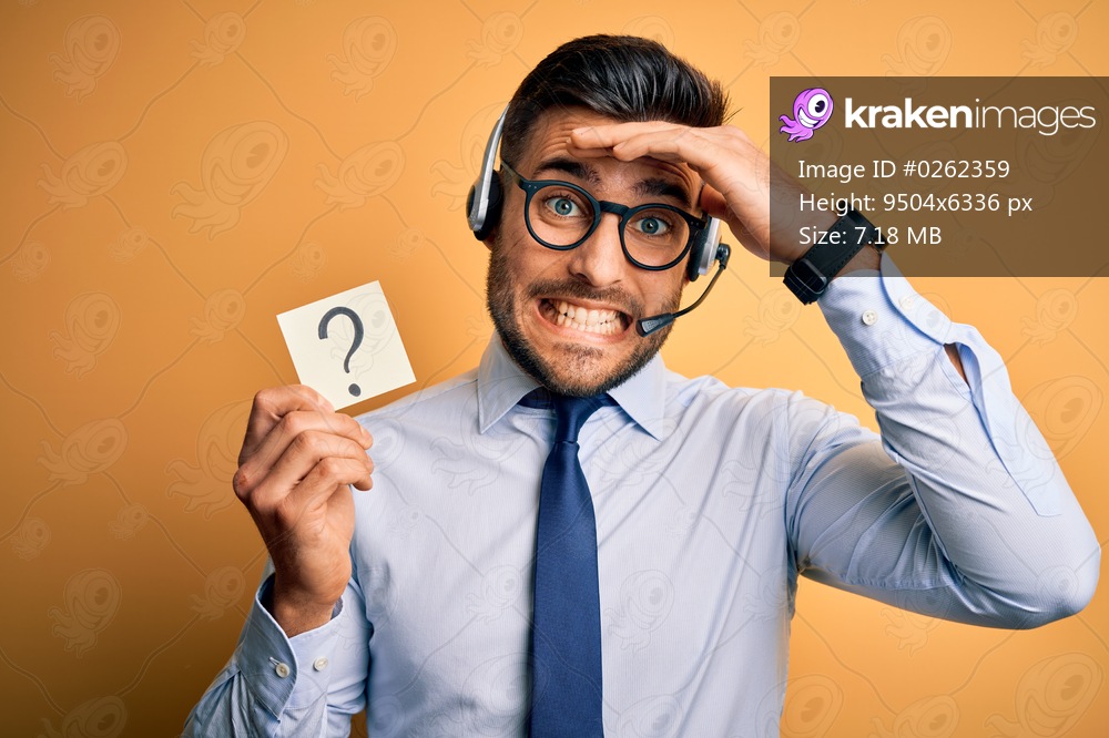 Business operator man with customer service headset from call center showing question mark stressed with hand on head, shocked with shame and surprise face, angry and frustrated. Fear and upset for mistake.