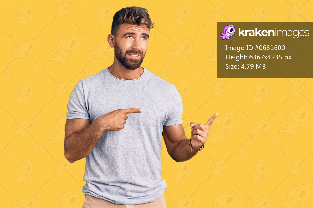 Young hispanic man wearing casual clothes pointing aside worried and nervous with both hands, concerned and surprised expression 