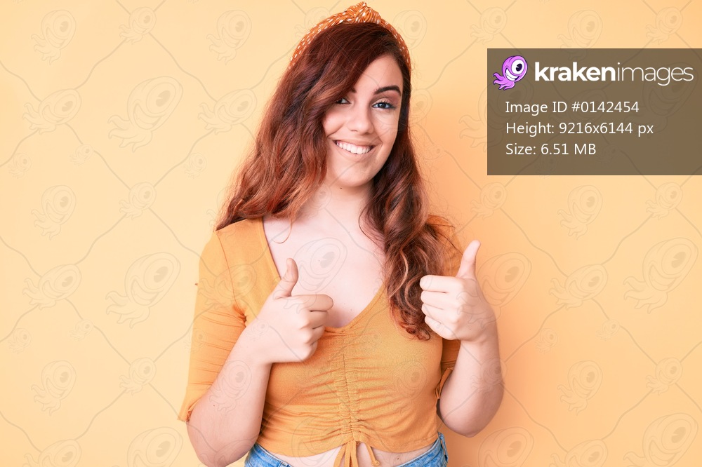 Young beautiful woman wearing casual clothes success sign doing positive gesture with hand, thumbs up smiling and happy. cheerful expression and winner gesture. 