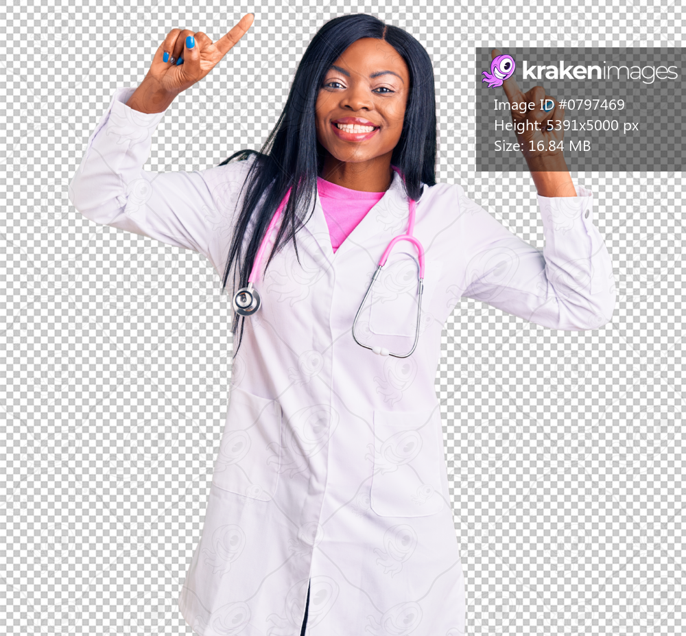 Young african american woman wearing doctor stethoscope smiling amazed and surprised and pointing up with fingers and raised arms.