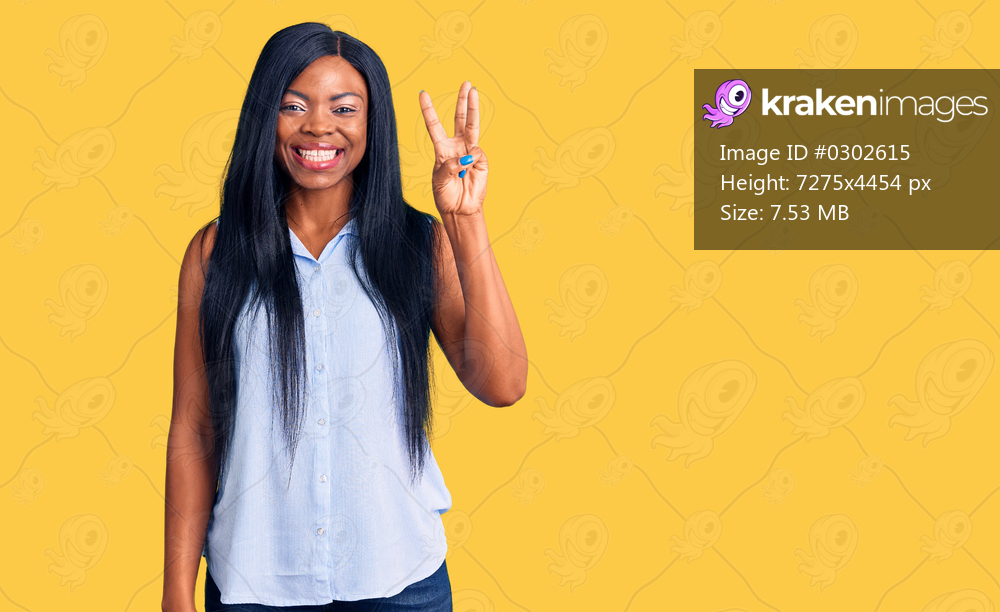 Young african american woman wearing casual clothes showing and pointing up with fingers number three while smiling confident and happy. 