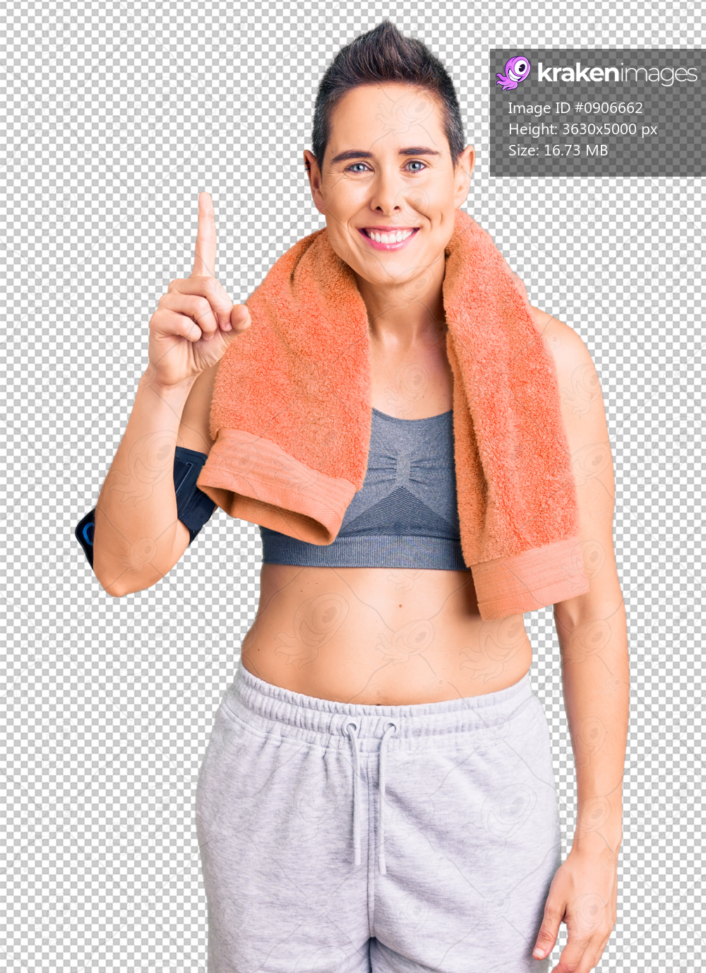 Young woman with short hair wearing sportswear and towel using smartphone showing and pointing up with finger number one while smiling confident and happy.