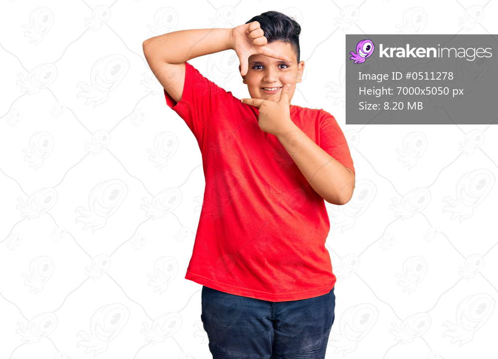 Little boy kid wearing casual clothes smiling making frame with hands and fingers with happy face. creativity and photography concept. 