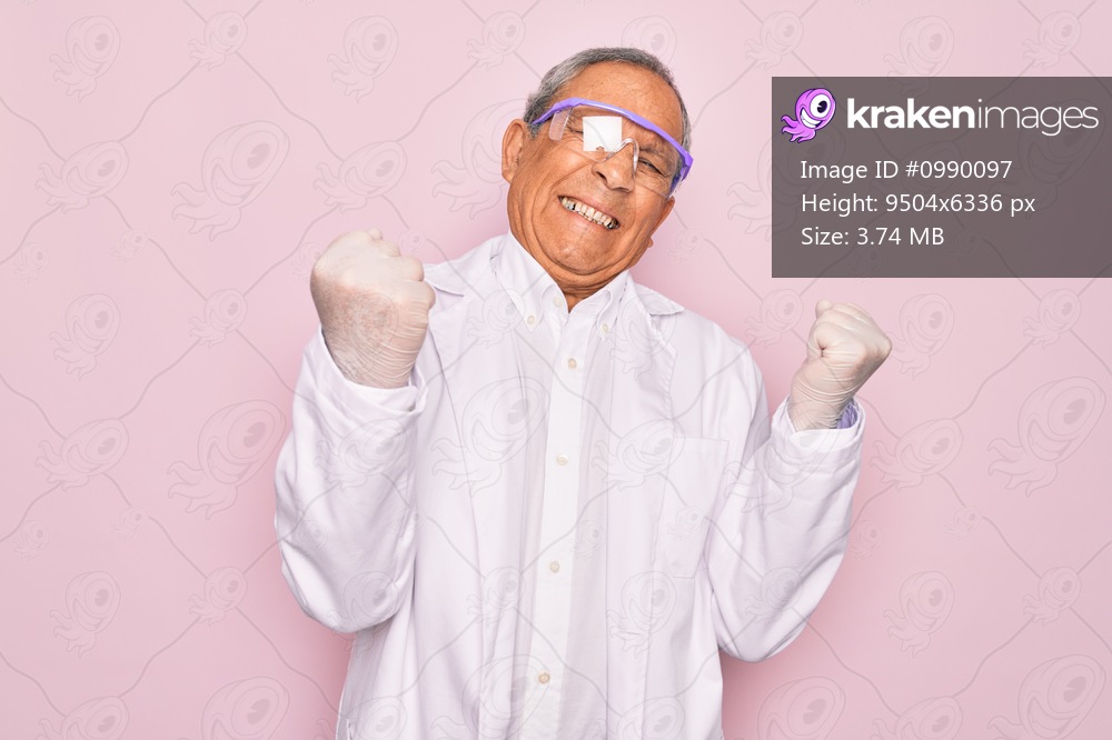Senior grey-haired scientist man wearing glasses and coat over isolated pink background very happy and excited doing winner gesture with arms raised, smiling and screaming for success. Celebration concept.