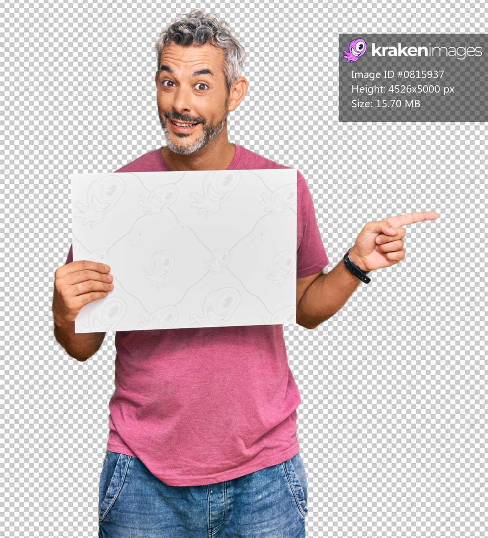 Middle age grey-haired man holding blank empty banner smiling happy pointing with hand and finger to the side