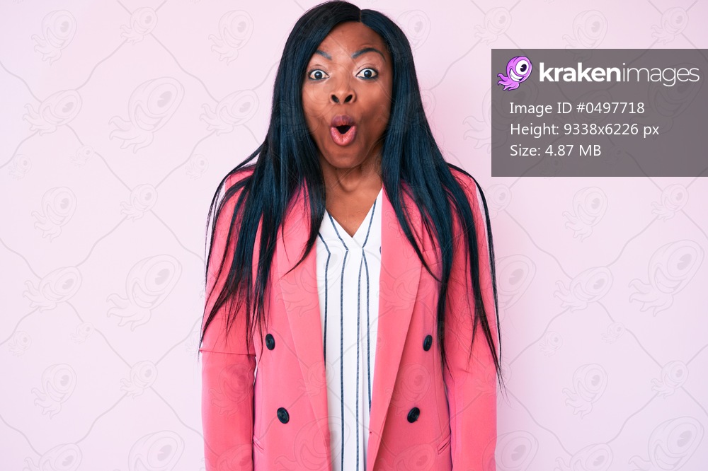 Young african american woman wearing business clothes afraid and shocked with surprise expression, fear and excited face. 