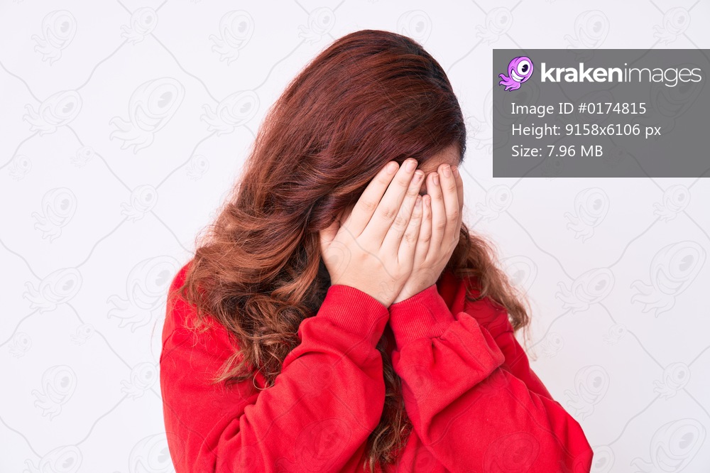 Young beautiful woman wearing casual clothes with sad expression covering face with hands while crying. depression concept. 