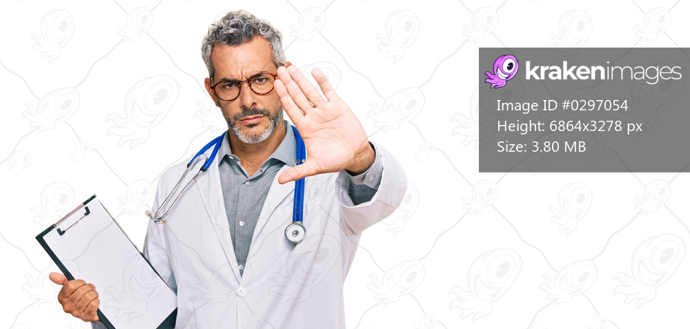 Middle age grey-haired man wearing doctor stethoscope holding clipboard with open hand doing stop sign with serious and confident expression, defense gesture 