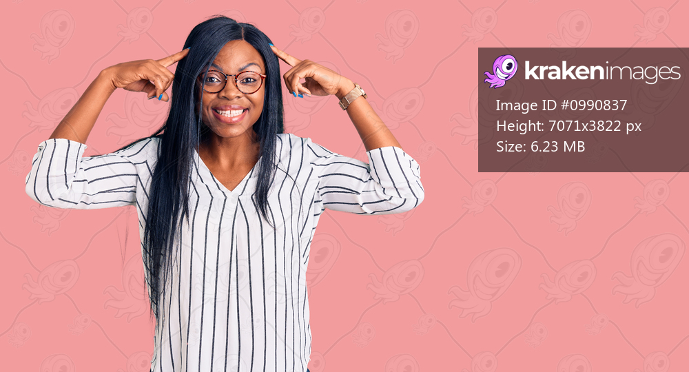 Young african american woman wearing casual clothes and glasses smiling pointing to head with both hands finger, great idea or thought, good memory 